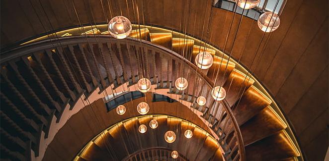 Hanging lights on a spiral staircase